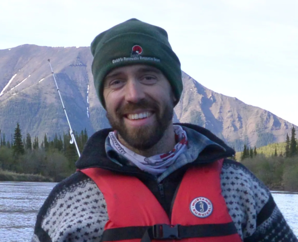 Headshot of Jeremy Brammer with lake and mountain in background