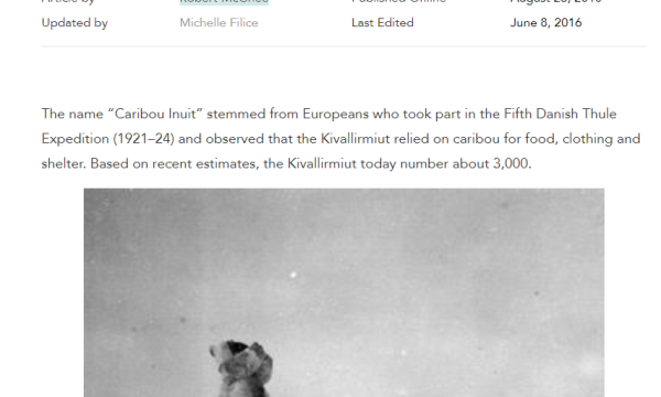 Two Inuit hunters looking into the distance